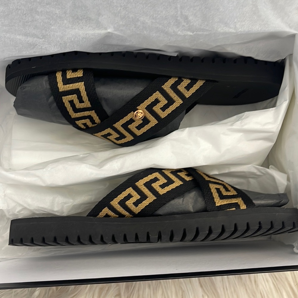 Brand new Versace slides with Greca print. Size 41. Never worn.